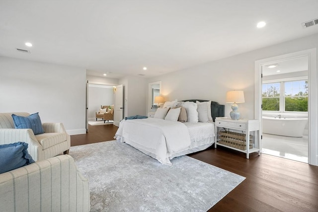 bedroom featuring connected bathroom, visible vents, dark wood-type flooring, and recessed lighting