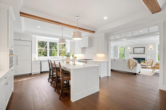 kitchen featuring light countertops, beamed ceiling, and dark wood finished floors