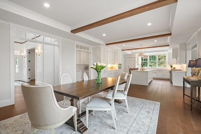 dining room with dark wood-type flooring, beamed ceiling, visible vents, and crown molding