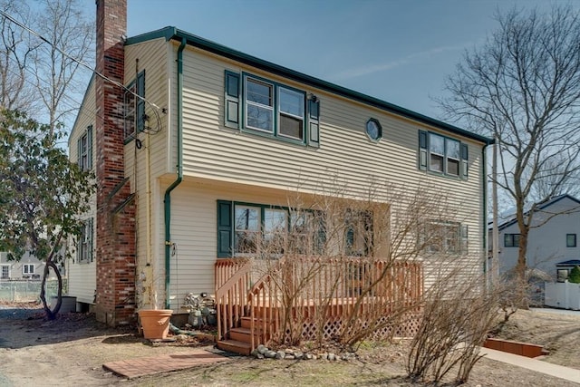 view of front of home featuring a chimney