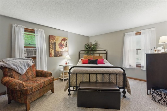 bedroom with carpet flooring, baseboards, and cooling unit
