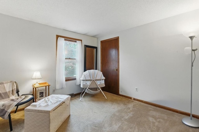 living area with baseboards and carpet flooring