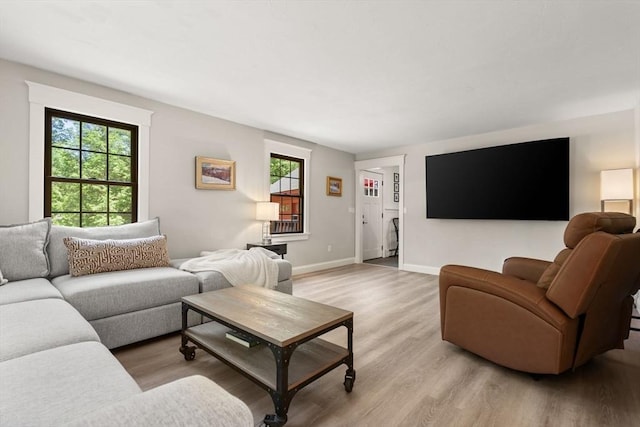38 Manchaug Rd, Sutton, MA 01590 - living room with light wood finished floors and baseboards