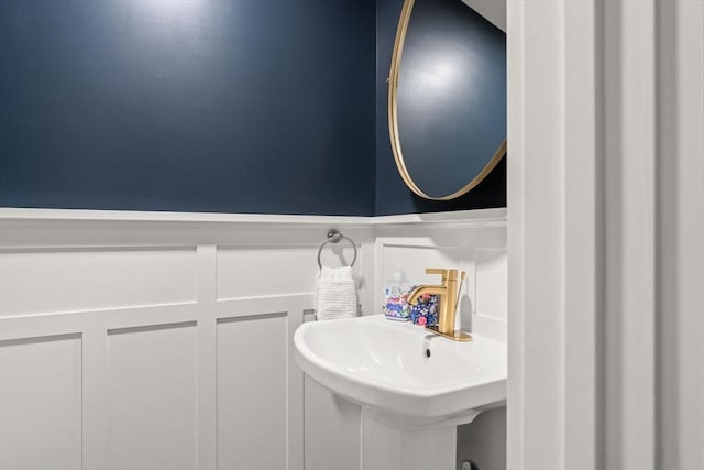 38 Manchaug Rd, Sutton, MA 01590 - bathroom with wainscoting and a decorative wall