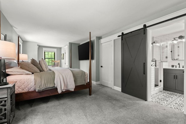 38 Manchaug Rd, Sutton, MA 01590 - bedroom featuring a barn door, light carpet, and ensuite bathroom