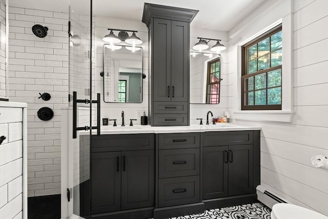 38 Manchaug Rd, Sutton, MA 01590 - full bath featuring a tile shower, double vanity, and a baseboard radiator