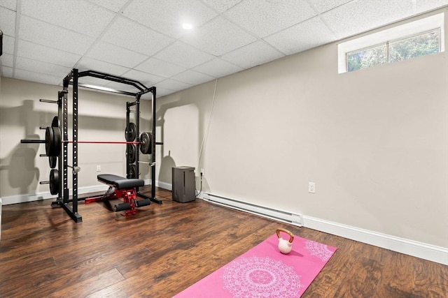 38 Manchaug Rd, Sutton, MA 01590 - exercise room with baseboard heating, wood finished floors, and a drop ceiling
