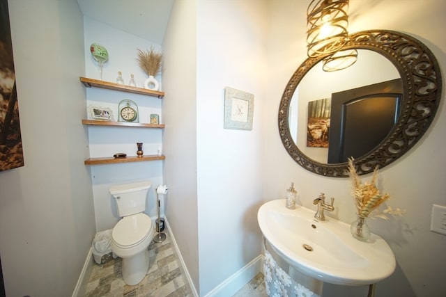 bathroom with toilet and sink