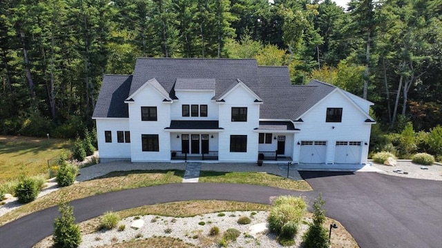 114 Country Club Way, Kingston, MA 02364 - modern farmhouse style home featuring driveway, a garage, a forest view, and roof with shingles