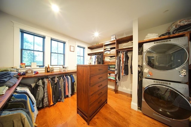 114 Country Club Way, Kingston, MA 02364 - laundry area featuring light wood-type flooring, stacked washing maching and dryer, and laundry area