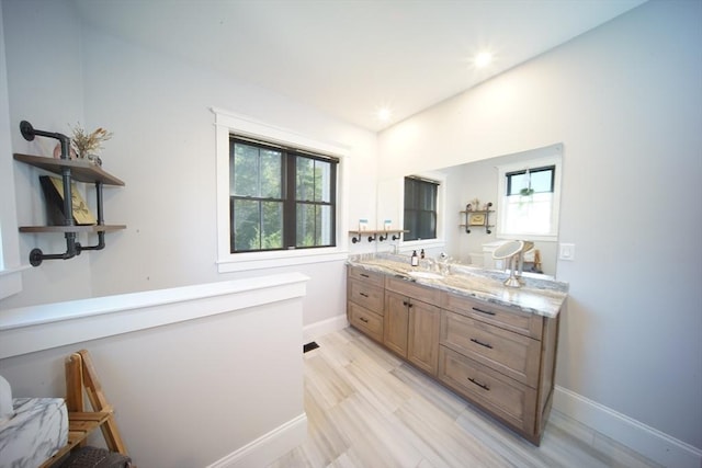 114 Country Club Way, Kingston, MA 02364 - bathroom featuring baseboards, wood finished floors, recessed lighting, and vanity