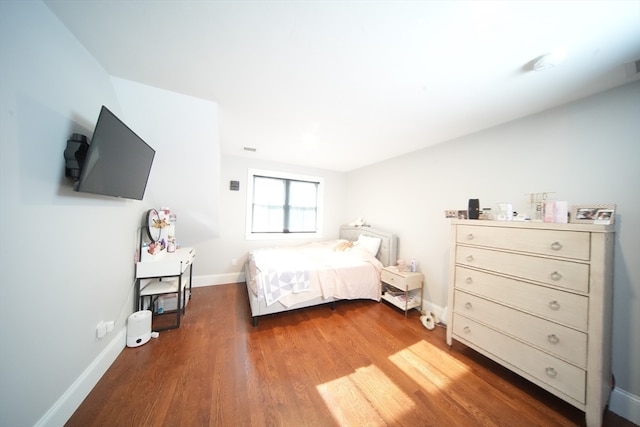 bedroom featuring dark hardwood / wood-style floors