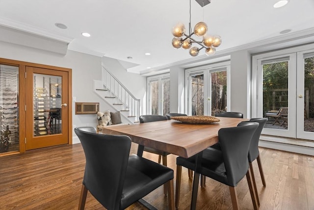 dining area with ornamental molding, wood finished floors, recessed lighting, french doors, and stairs