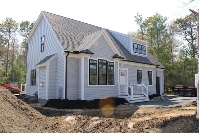 view of front of house with roof with shingles