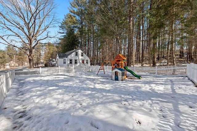 exterior space featuring a playground and fence private yard