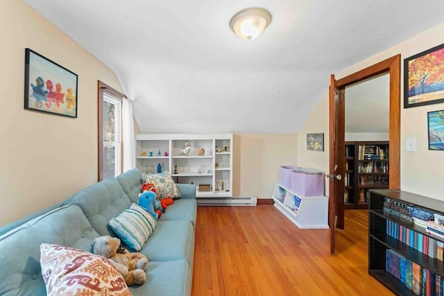 living room featuring lofted ceiling, wood finished floors, and baseboard heating