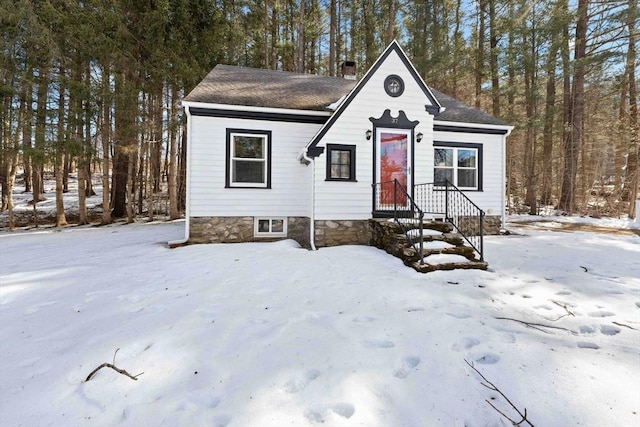 view of front of home featuring a chimney