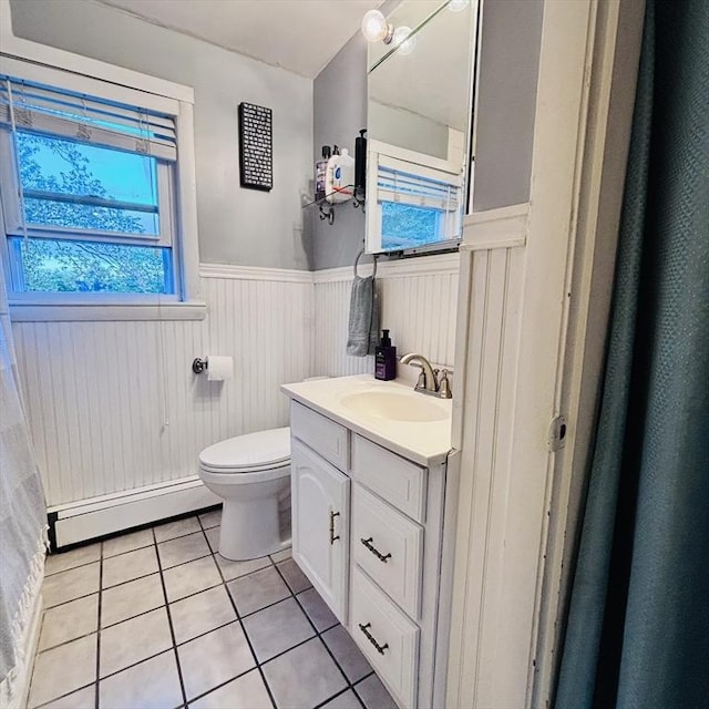 368 W St, Randolph, MA 02368 - bathroom with a baseboard radiator, wainscoting, tile patterned flooring, toilet, and vanity
