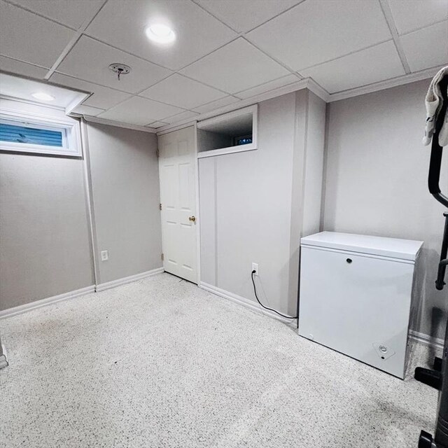 368 W St, Randolph, MA 02368 - below grade area featuring fridge, a paneled ceiling, and baseboards