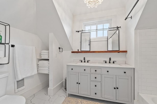 full bathroom with baseboards, a sink, marble finish floor, and toilet