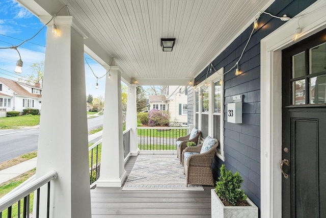 wooden deck featuring covered porch