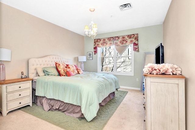 bedroom featuring visible vents, light carpet, baseboards, and a chandelier