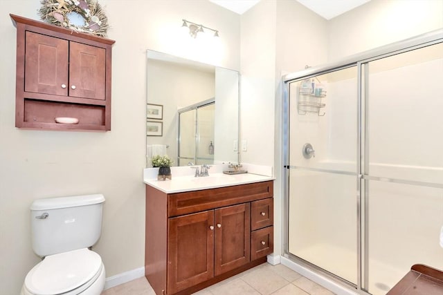 bathroom with toilet, a stall shower, tile patterned flooring, baseboards, and vanity