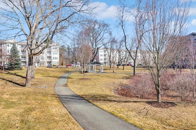 surrounding community with a gazebo and a lawn