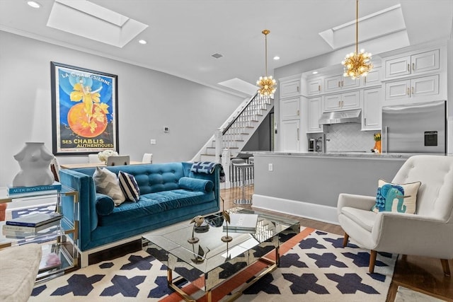 19 Greenwich Park Unit 5, Boston, MA 02118 - living area featuring a skylight, stairs, wood finished floors, recessed lighting, and a chandelier