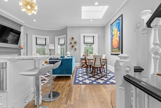 19 Greenwich Park Unit 5, Boston, MA 02118 - living area with wood finished floors, a skylight, crown molding, and recessed lighting