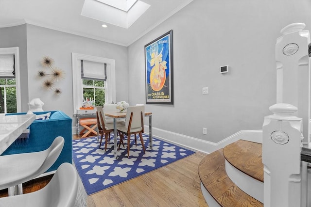 19 Greenwich Park Unit 5, Boston, MA 02118 - dining area featuring a skylight, healthy amount of natural light, wood finished floors, ornamental molding, and recessed lighting