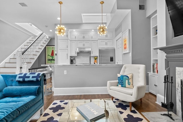 19 Greenwich Park Unit 5, Boston, MA 02118 - living area featuring a chandelier, stairway, dark wood-style flooring, and recessed lighting