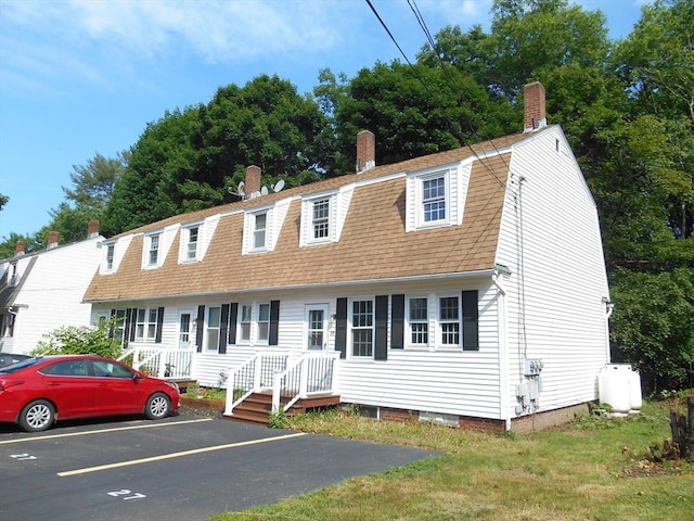 23 Trafalgar Sq Unit 23, Barre, MA 01005 - colonial inspired home featuring a gambrel roof, uncovered parking, a chimney, and roof with shingles
