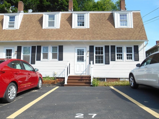 23 Trafalgar Sq Unit 23, Barre, MA 01005 - view of front of property featuring roof with shingles, entry steps, uncovered parking, and a chimney