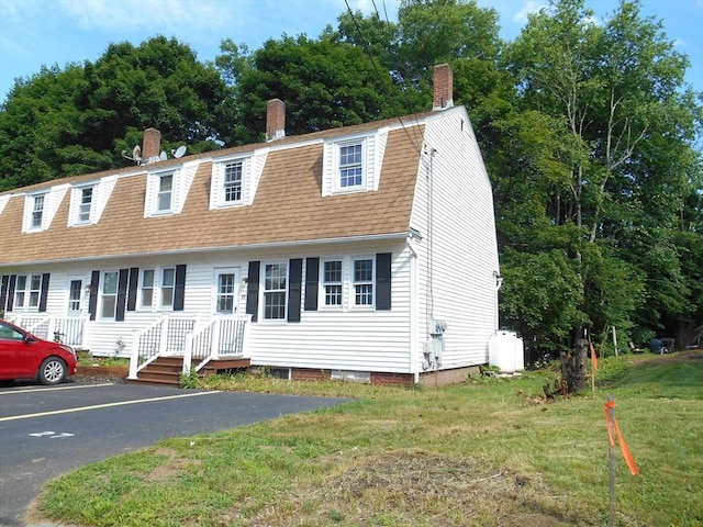 23 Trafalgar Sq Unit 23, Barre, MA 01005 - colonial inspired home with a chimney, a gambrel roof, a front lawn, and a shingled roof