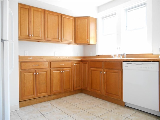 23 Trafalgar Sq Unit 23, Barre, MA 01005 - kitchen featuring white appliances, brown cabinets, light countertops, and light tile patterned floors