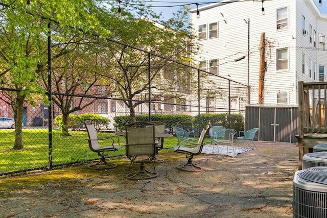 106 Walnut St Unit 4, Somerville, MA 02145 - view of patio featuring cooling unit and an outbuilding