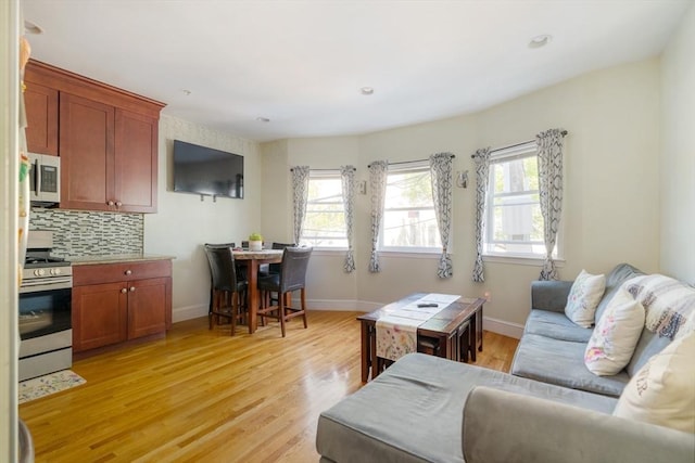 106 Walnut St Unit 4, Somerville, MA 02145 - living area with light wood-style floors and baseboards