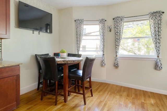 106 Walnut St Unit 4, Somerville, MA 02145 - dining room with light wood-style floors and baseboards