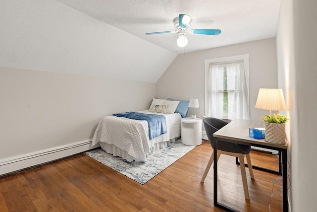 4 Rendall Pl, Melrose, MA 02176 - bedroom featuring wood finished floors, a baseboard heating unit, vaulted ceiling, an office area, and a ceiling fan