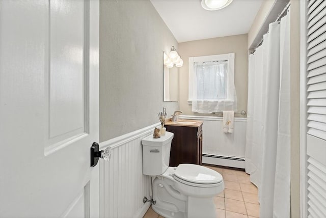 4 Rendall Pl, Melrose, MA 02176 - bathroom with baseboard heating, toilet, vanity, tile patterned floors, and a wainscoted wall