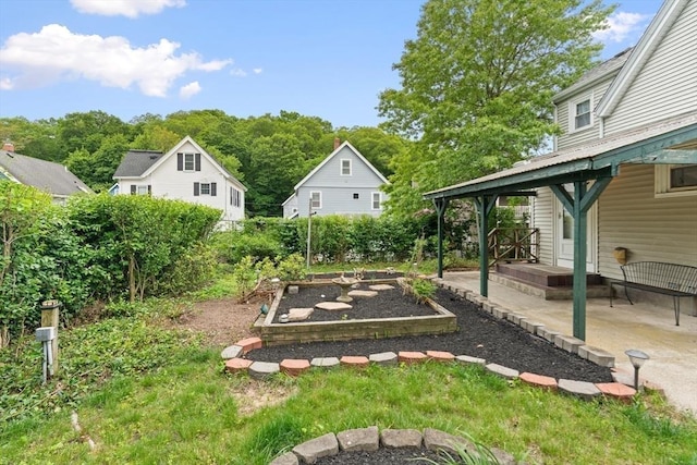 4 Rendall Pl, Melrose, MA 02176 - view of yard featuring a vegetable garden and a patio