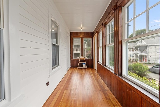 4 Rendall Pl, Melrose, MA 02176 - unfurnished sunroom with wood walls and hardwood / wood-style floors