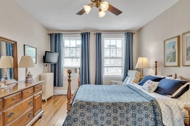 15 Thatcher St Unit F2-2, Brookline, MA 02446 - bedroom featuring radiator, light wood finished floors, and a ceiling fan