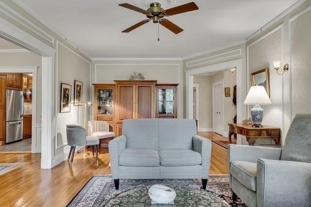 15 Thatcher St Unit F2-2, Brookline, MA 02446 - living room featuring a ceiling fan, light wood-type flooring, and crown molding
