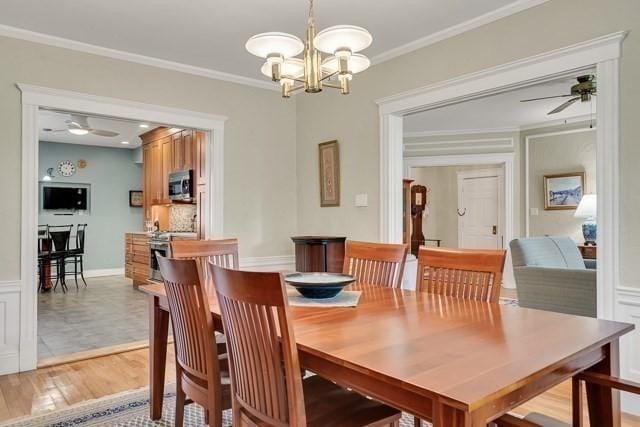 15 Thatcher St Unit F2-2, Brookline, MA 02446 - dining area featuring ceiling fan, a chandelier, ornamental molding, and light wood-type flooring