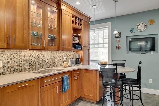 15 Thatcher St Unit F2-2, Brookline, MA 02446 - bar with tasteful backsplash and pendant lighting