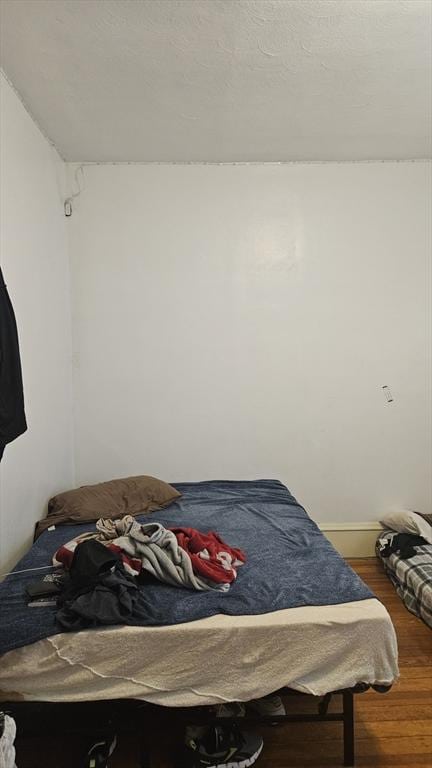 bedroom featuring wood finished floors