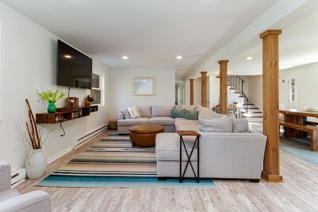 living room with baseboard heating, stairs, recessed lighting, wood finished floors, and a baseboard radiator