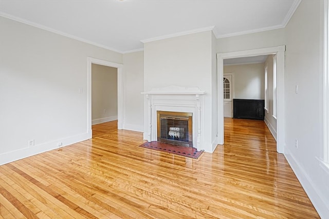 1 Melville St, Worcester, MA 01605 - unfurnished living room with light wood-style floors, a fireplace with flush hearth, ornamental molding, and baseboards